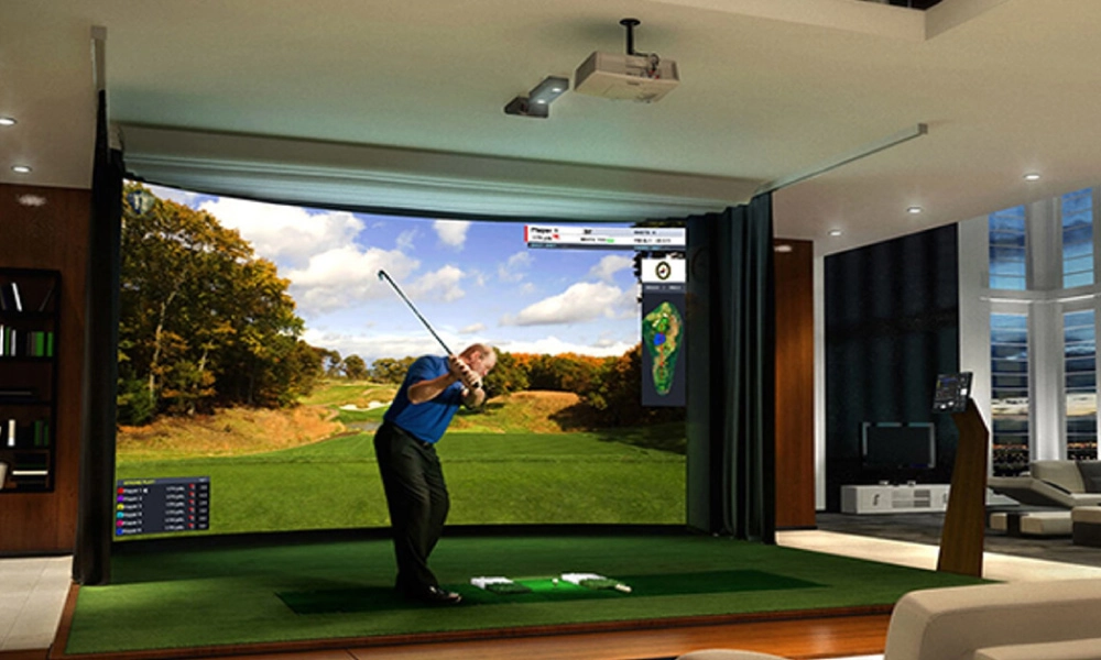 basement golf simulator room with curtains separating the simulator area from the rest of the space.