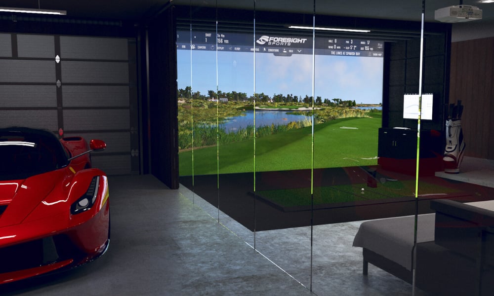 glass border between car parking space and golf simulator setup