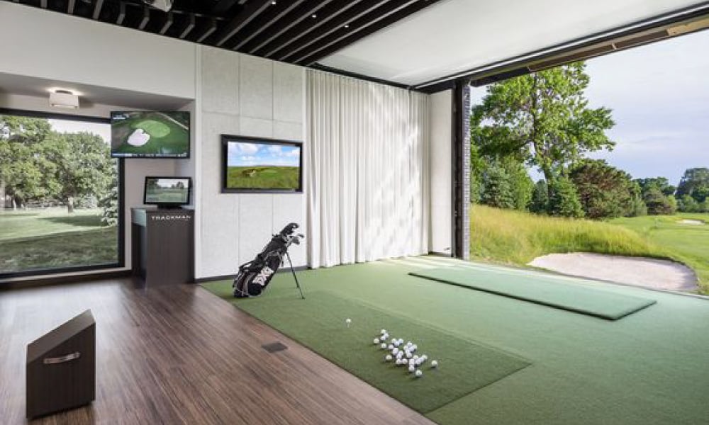 golf simulator room with professional grade equipment