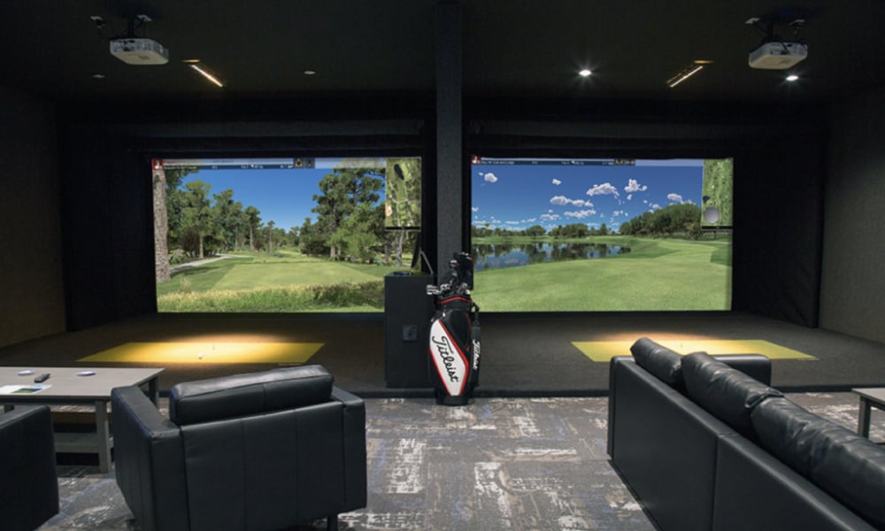 golf simulator room with specialized lighting designed to replicate the lighting conditions of a real golf course